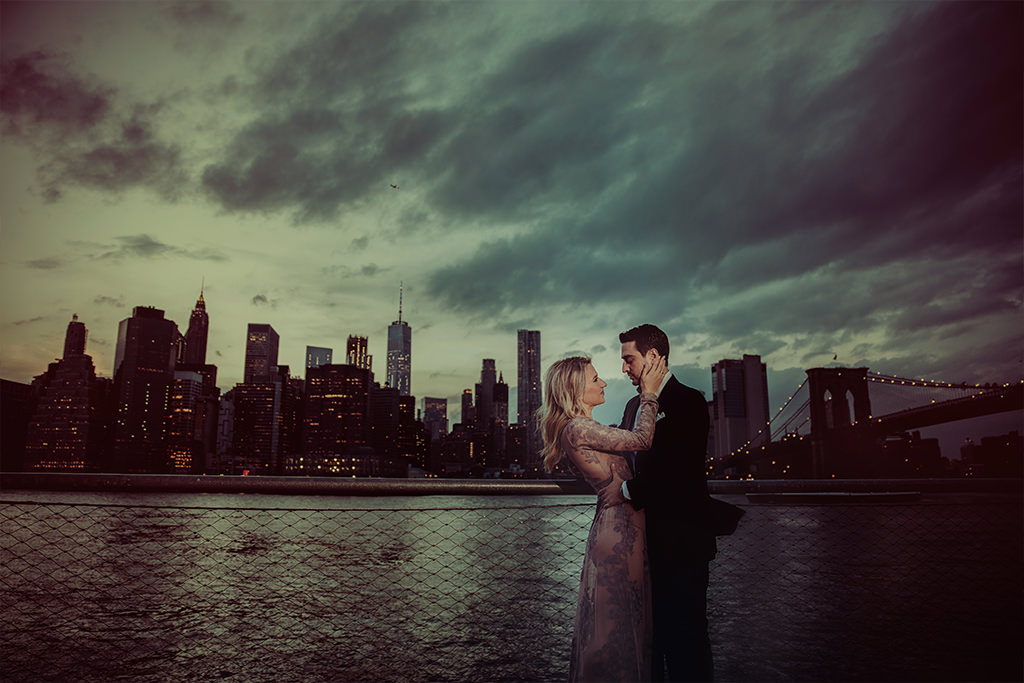 Well-dressed couple with Manhattan in the background.